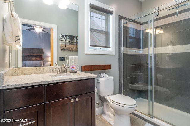 106 NW 8th St, Oak Island, NC 28465 - ensuite bathroom featuring toilet, vanity, a shower stall, and tile patterned floors