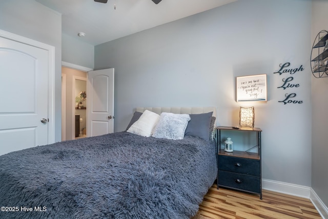 106 NW 8th St, Oak Island, NC 28465 - bedroom featuring wood finished floors, baseboards, and ceiling fan