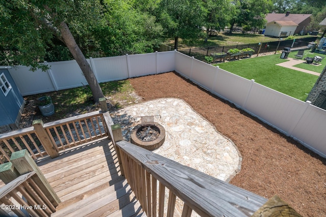 106 NW 8th St, Oak Island, NC 28465 - deck featuring a fire pit