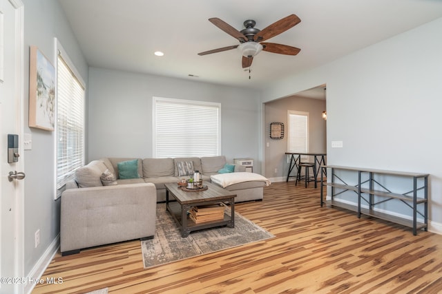 106 NW 8th St, Oak Island, NC 28465 - living room with ceiling fan, wood finished floors, baseboards, and recessed lighting