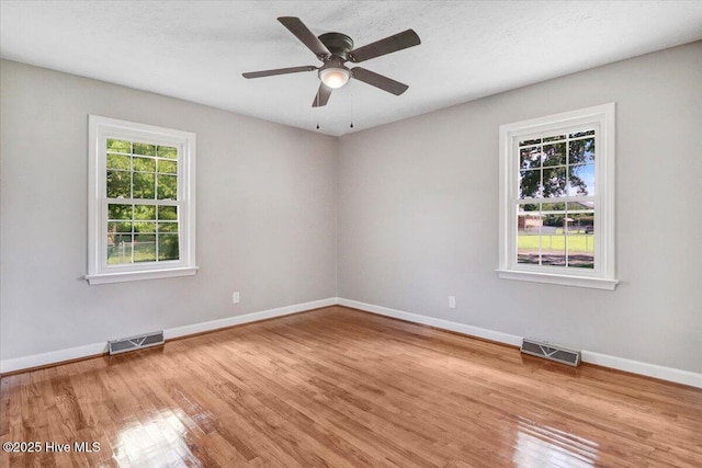 1102 Elanor Ave, Goldsboro, NC 27530 - unfurnished room with wood finished floors, baseboards, and a ceiling fan