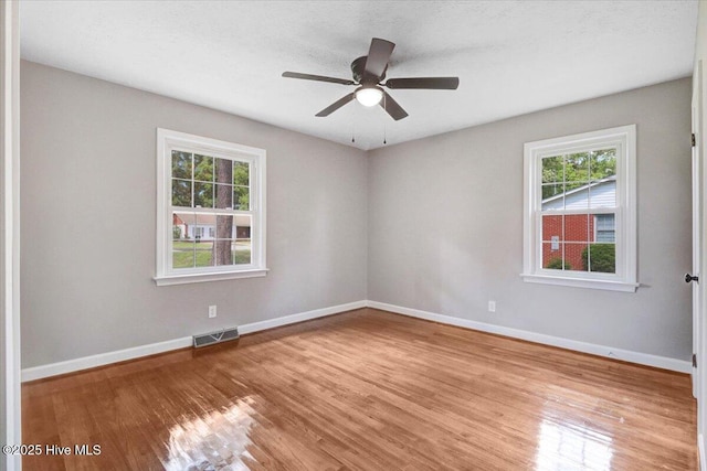 1102 Elanor Ave, Goldsboro, NC 27530 - spare room with plenty of natural light, wood finished floors, and baseboards