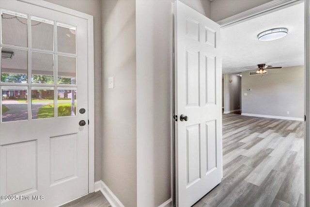 1102 Elanor Ave, Goldsboro, NC 27530 - entryway featuring baseboards, wood finished floors, and a ceiling fan