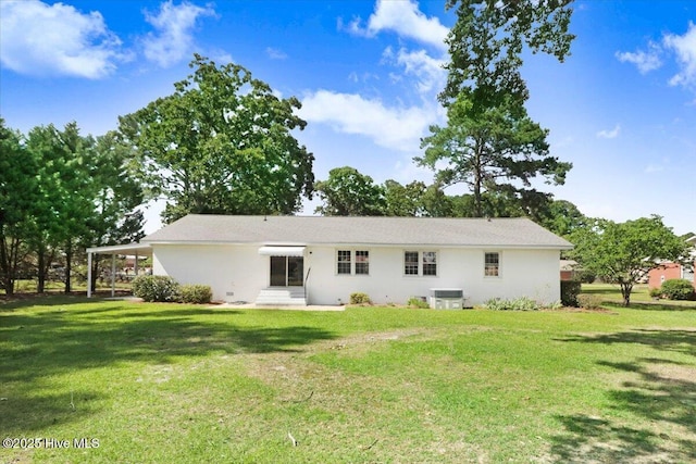1102 Elanor Ave, Goldsboro, NC 27530 - back of house with central AC, a lawn, and stucco siding