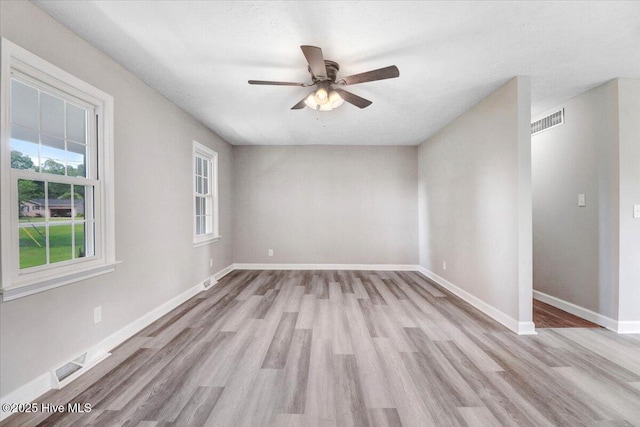 1102 Elanor Ave, Goldsboro, NC 27530 - spare room with wood finished floors, ceiling fan, and baseboards