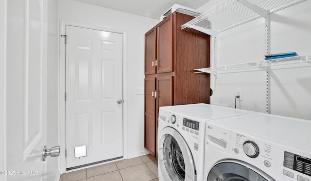 416 Point View Ct, Wilmington, NC 28411 - washroom featuring washer and clothes dryer, cabinet space, and light tile patterned floors