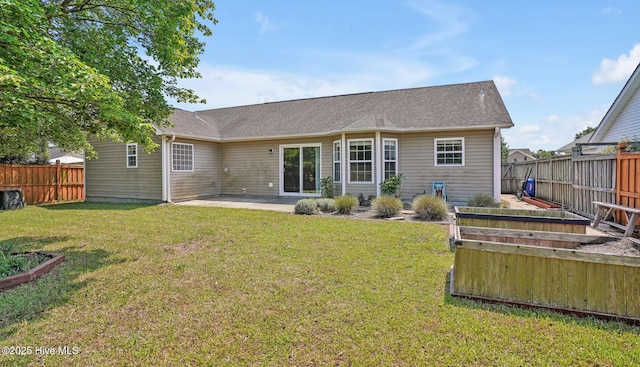 416 Point View Ct, Wilmington, NC 28411 - back of house with a vegetable garden and a patio area