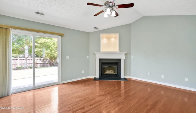 416 Point View Ct, Wilmington, NC 28411 - unfurnished living room featuring a ceiling fan, wood finished floors, baseboards, a glass covered fireplace, and lofted ceiling