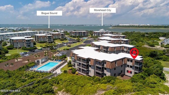 2008 E Fort Macon Rd Unit A-1, Atlantic Beach, NC 28512 - bird's eye view of a pool area, a nearby body of water, and apartment complex / building