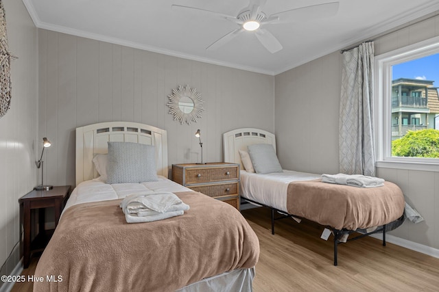 2008 E Fort Macon Rd Unit A-1, Atlantic Beach, NC 28512 - bedroom with wood finished floors, ornamental molding, a ceiling fan, and baseboards
