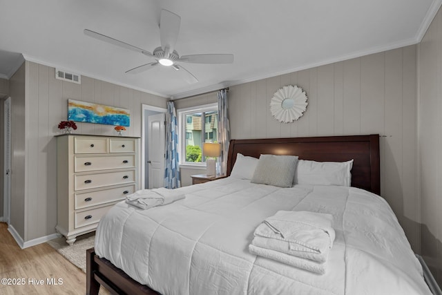 2008 E Fort Macon Rd Unit A-1, Atlantic Beach, NC 28512 - bedroom with ornamental molding, wood finished floors, a ceiling fan, and baseboards