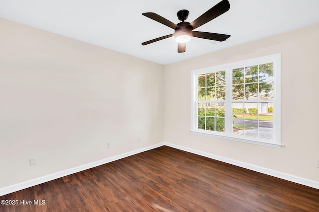 562 Anchor Way, Kure Beach, NC 28449 - unfurnished room featuring baseboards, dark wood finished floors, and ceiling fan