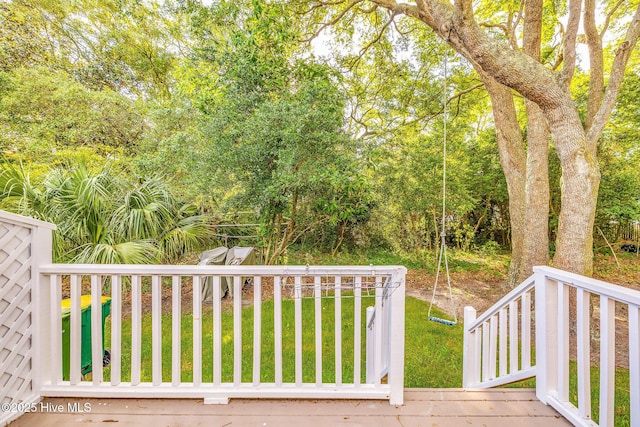 562 Anchor Way, Kure Beach, NC 28449 - wooden deck featuring a lawn