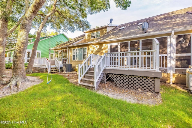 562 Anchor Way, Kure Beach, NC 28449 - rear view of property featuring a deck, a yard, central air condition unit, and roof with shingles
