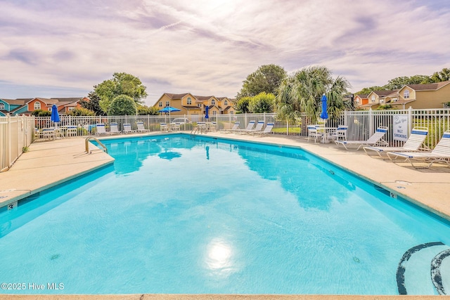562 Anchor Way, Kure Beach, NC 28449 - community pool featuring a patio area and a residential view