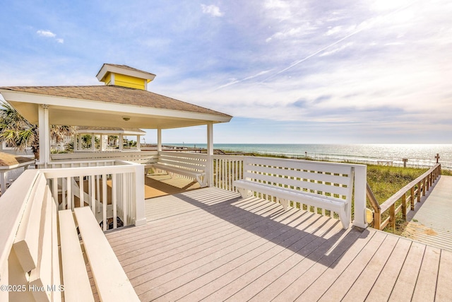 562 Anchor Way, Kure Beach, NC 28449 - wooden deck featuring a gazebo and view of water and beach