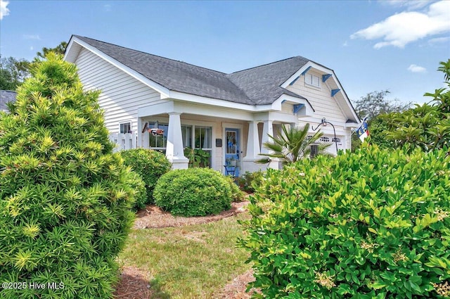 2121 Maple Leaf Dr, Southport, NC 28461 - view of front of property with roof with shingles and covered porch
