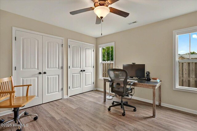2121 Maple Leaf Dr, Southport, NC 28461 - office featuring wood finished floors, healthy amount of natural light, and baseboards