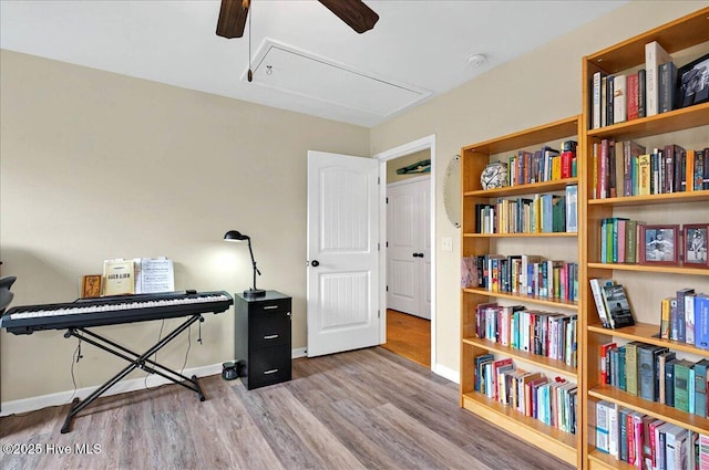 2121 Maple Leaf Dr, Southport, NC 28461 - office area featuring attic access, a ceiling fan, wood finished floors, and baseboards