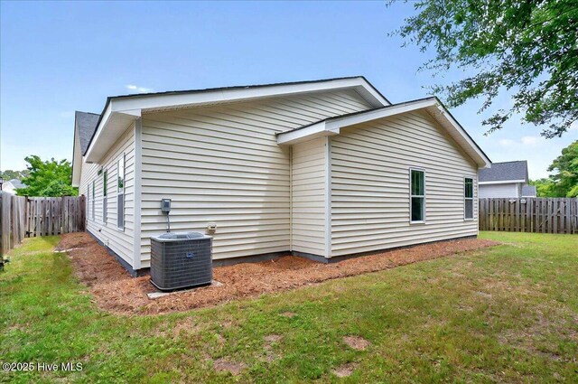 2121 Maple Leaf Dr, Southport, NC 28461 - view of side of property featuring central AC