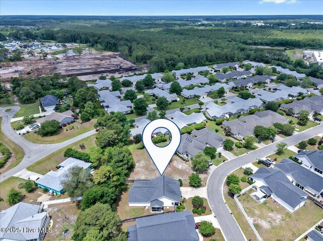 2121 Maple Leaf Dr, Southport, NC 28461 - aerial overview of property's location with a heavily wooded area and nearby suburban area