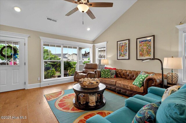 2121 Maple Leaf Dr, Southport, NC 28461 - living room featuring ceiling fan, hardwood / wood-style floors, recessed lighting, high vaulted ceiling, and baseboards