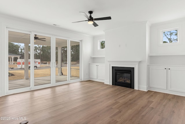 3924 Watersail Dr Unit 88, Wilmington, NC 28409 - unfurnished living room with a ceiling fan, crown molding, wood finished floors, and plenty of natural light