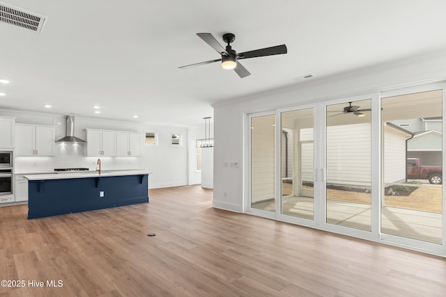 3924 Watersail Dr Unit 88, Wilmington, NC 28409 - unfurnished living room with a ceiling fan, a sink, light wood-type flooring, recessed lighting, and crown molding