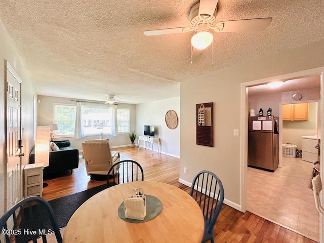 502 Dogwood Ln, Jacksonville, NC 28540 - dining area featuring ceiling fan, wood finished floors, a textured ceiling, and baseboards