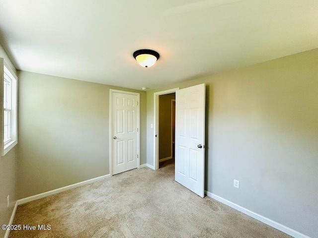 502 Dogwood Ln, Jacksonville, NC 28540 - unfurnished bedroom with baseboards and carpet floors