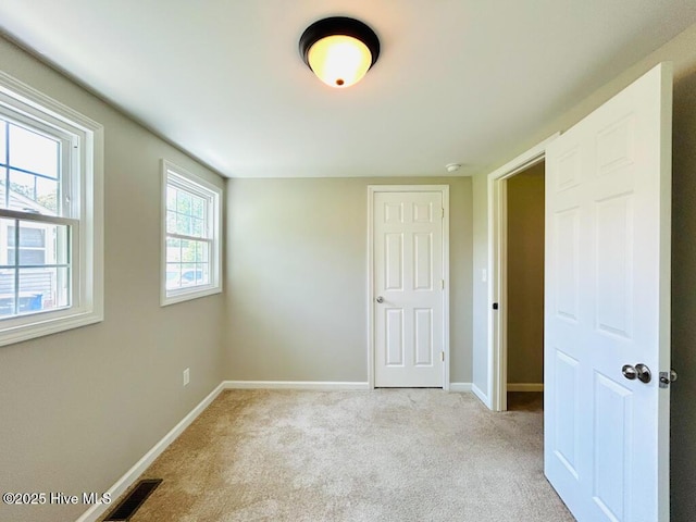 502 Dogwood Ln, Jacksonville, NC 28540 - unfurnished bedroom with baseboards and carpet flooring