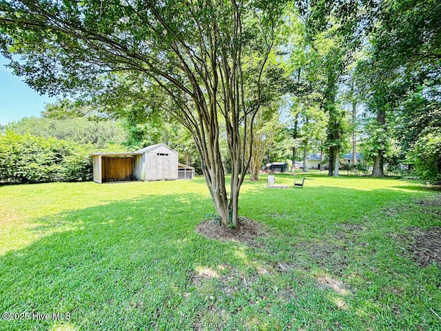 502 Dogwood Ln, Jacksonville, NC 28540 - view of grassy yard with an outdoor structure