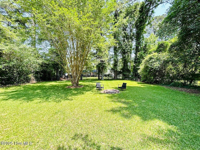 502 Dogwood Ln, Jacksonville, NC 28540 - view of grassy yard featuring a fire pit