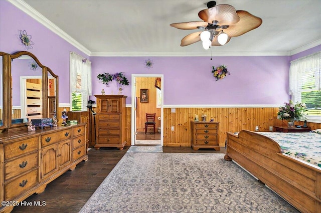 245 Green Bay Rd NW, Ocean Isle Beach, NC 28469 - bedroom featuring a wainscoted wall, dark wood finished floors, crown molding, and wooden walls