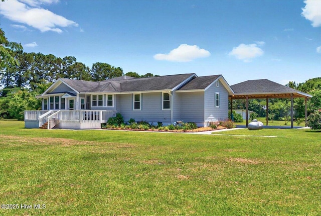 245 Green Bay Rd NW, Ocean Isle Beach, NC 28469 - view of front of property with a gazebo, a front yard, and an attached carport