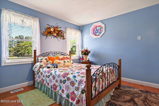 245 Green Bay Rd NW, Ocean Isle Beach, NC 28469 - bedroom featuring wood finished floors and baseboards