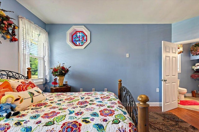 245 Green Bay Rd NW, Ocean Isle Beach, NC 28469 - bedroom featuring wood finished floors and baseboards