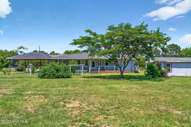 245 Green Bay Rd NW, Ocean Isle Beach, NC 28469 - back of property featuring a porch and a lawn