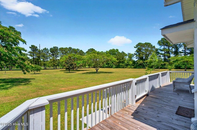 245 Green Bay Rd NW, Ocean Isle Beach, NC 28469 - wooden terrace featuring a lawn
