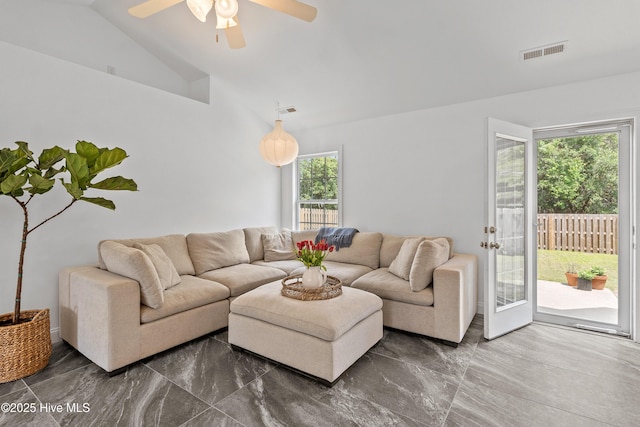 5018 Summerswell Ln, Southport, NC 28461 - living room featuring lofted ceiling, dark marble finish floors, and a ceiling fan