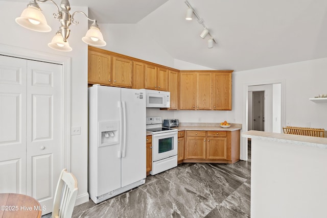 5018 Summerswell Ln, Southport, NC 28461 - kitchen featuring white appliances, vaulted ceiling, track lighting, light countertops, and dark marble finish floors