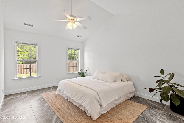 5018 Summerswell Ln, Southport, NC 28461 - bedroom with vaulted ceiling, baseboards, and ceiling fan