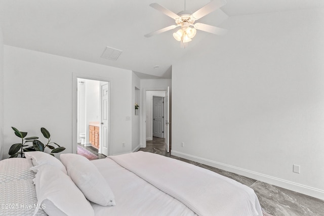 5018 Summerswell Ln, Southport, NC 28461 - bedroom with lofted ceiling, baseboards, a ceiling fan, and connected bathroom