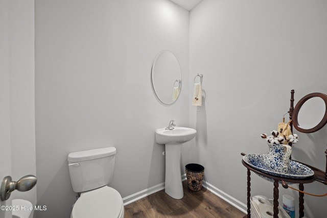 4345 Nine Iron Dr, Ayden, NC 28513 - half bathroom featuring wood finished floors, toilet, and baseboards