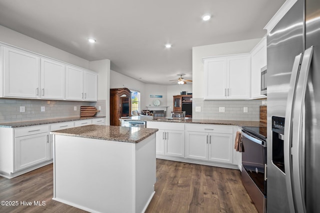 4345 Nine Iron Dr, Ayden, NC 28513 - kitchen featuring stainless steel appliances, ceiling fan, white cabinets, tasteful backsplash, and recessed lighting
