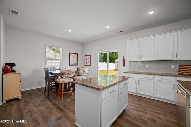 4345 Nine Iron Dr, Ayden, NC 28513 - kitchen with dark wood-type flooring, stone counters, decorative backsplash, white cabinets, and dishwasher