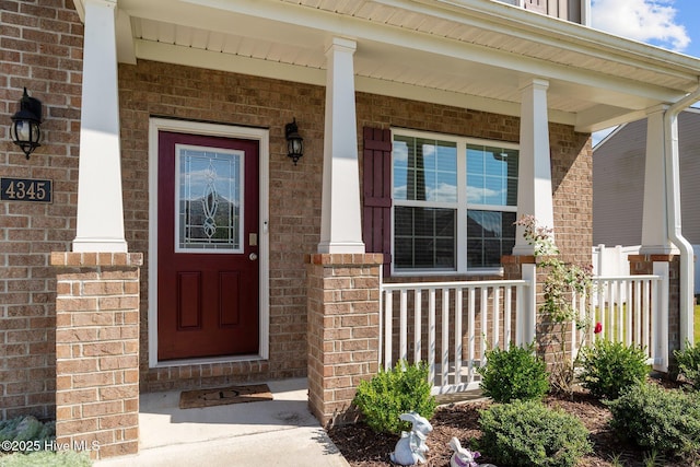 4345 Nine Iron Dr, Ayden, NC 28513 - doorway to property featuring a porch and brick siding