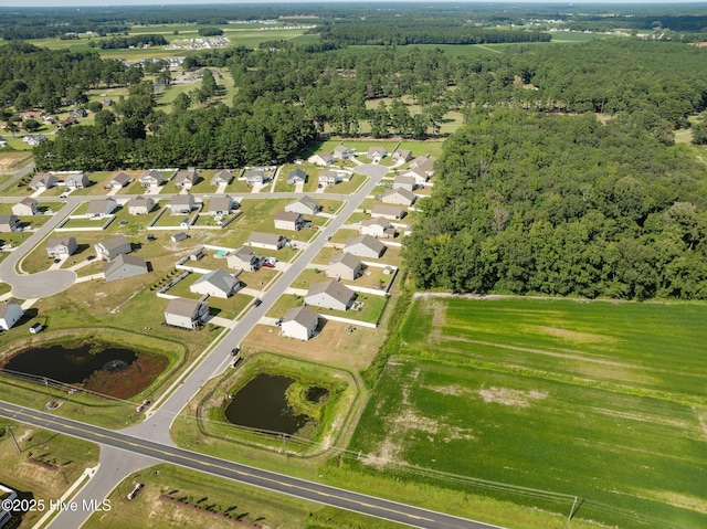4345 Nine Iron Dr, Ayden, NC 28513 - view of property location with a large body of water and a heavily wooded area