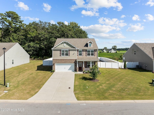 4345 Nine Iron Dr, Ayden, NC 28513 - view of front facade with driveway, a garage, covered porch, and brick siding