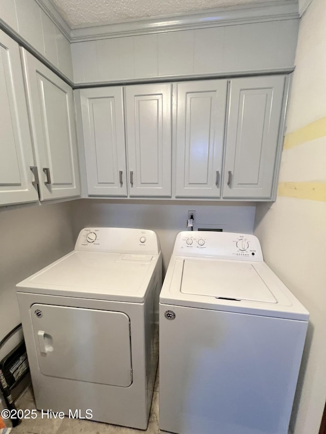 1811 Hermitage Rd NW, Wilson, NC 27896 - laundry area with cabinet space and washer and clothes dryer